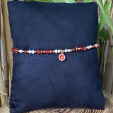 Bracelet nacre avec cristal de Swarovski rouge